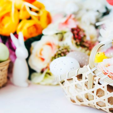 easter baskets with eggs and chicklings, rabbit and flowers