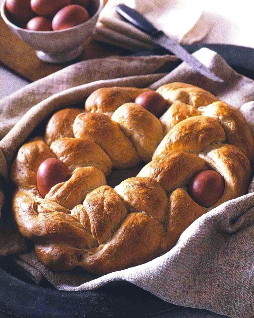 easter bread with colorful eggs baked into the woven dough
