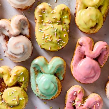 cinnamon rolls shaped like a bunny iced with colored icing and topped with sprinkles
