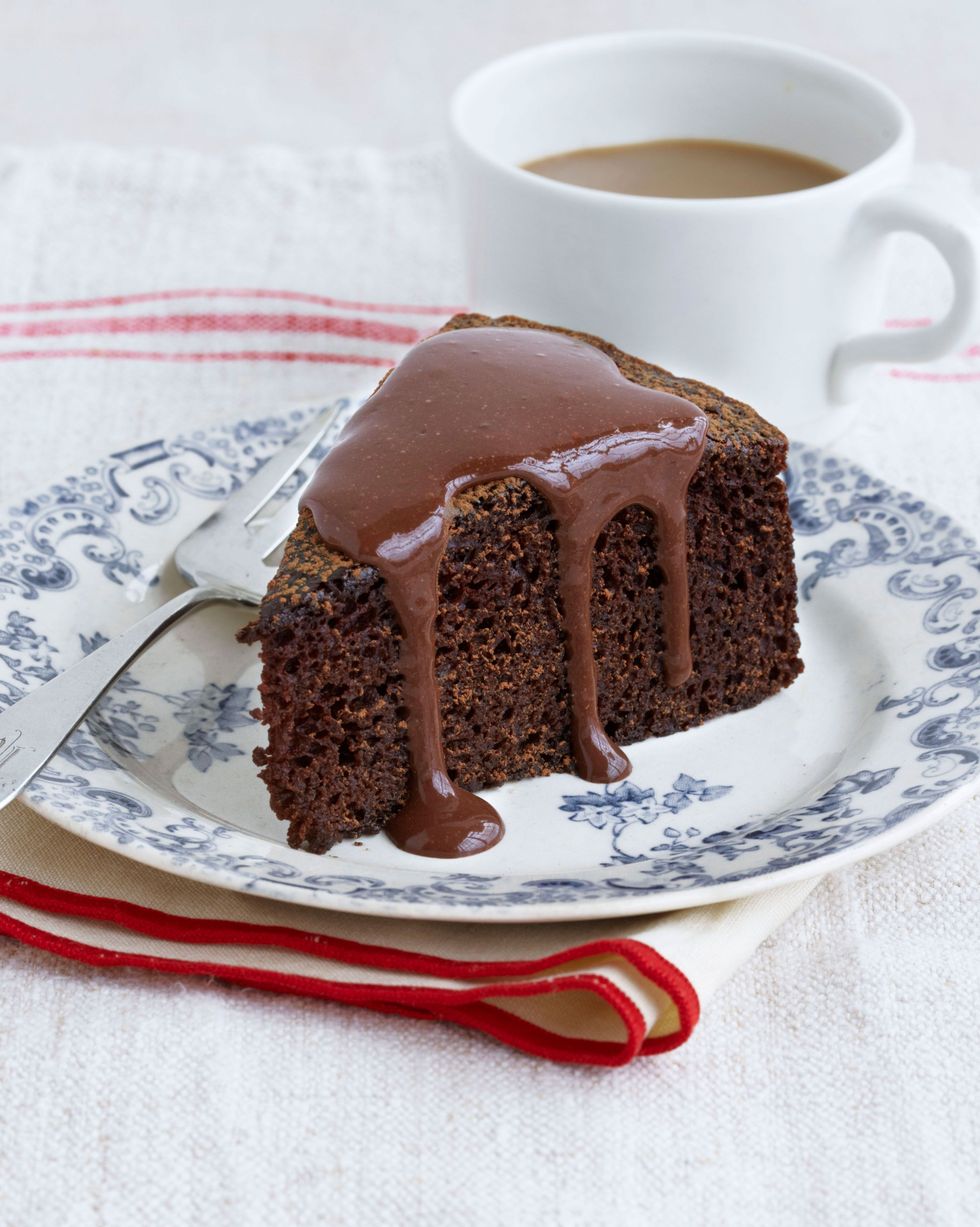 a slice of chocolate cake with chocolate orange sauce drizzled over the top