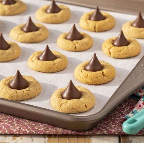 peanut butter blossom cookies on sheet tray