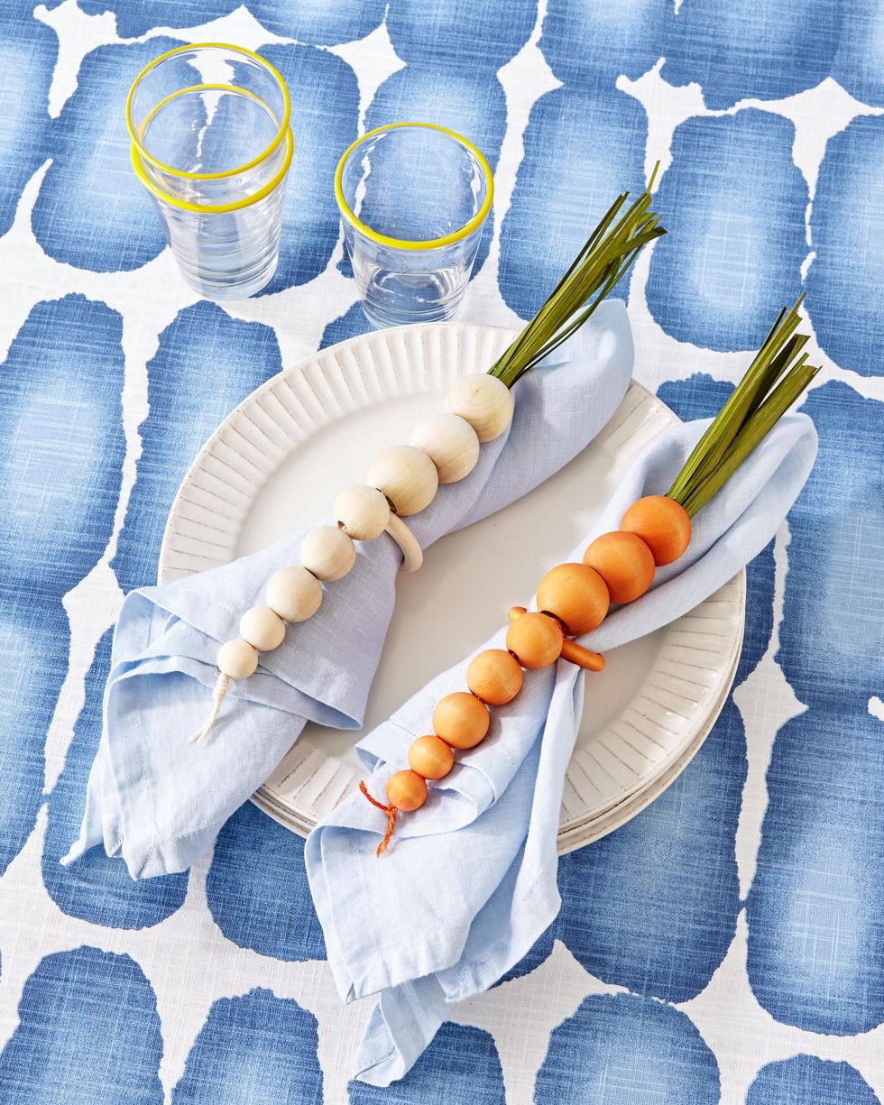 napkin rings made of beads and painted to look like parsnips and carrots