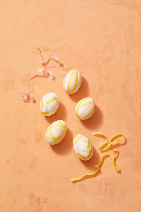 easter egg ideas, five pink and yellow tissue paper strip eggs