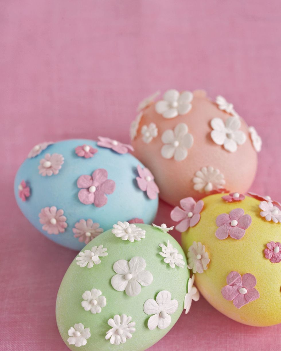 blown easter eggs dyed pastel blue, green, yellow or orange with 3 d flower decorations