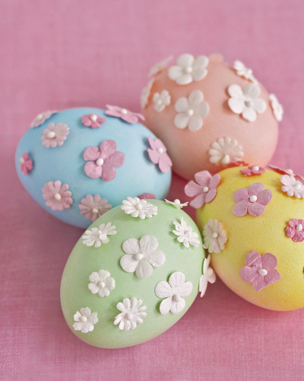 blown easter eggs dyed pastel blue, green, yellow or orange with 3 d flower decorations