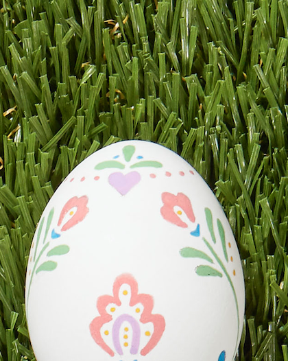 colorful swedish folk art floral design painted on white easter egg