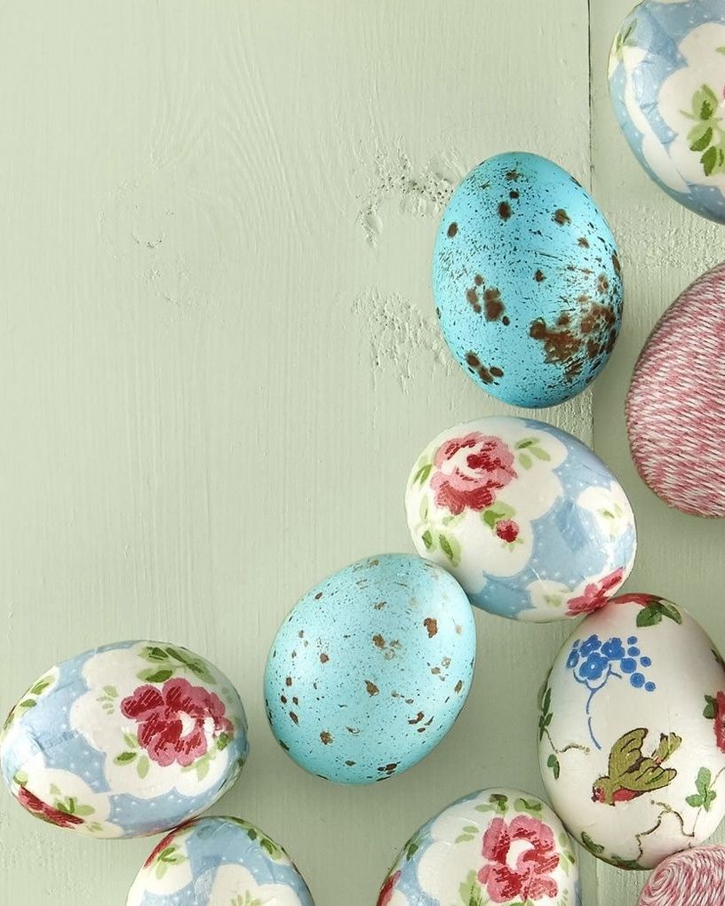 trio of easter eggs designs decorated with twine, floral paper napkins, and paint