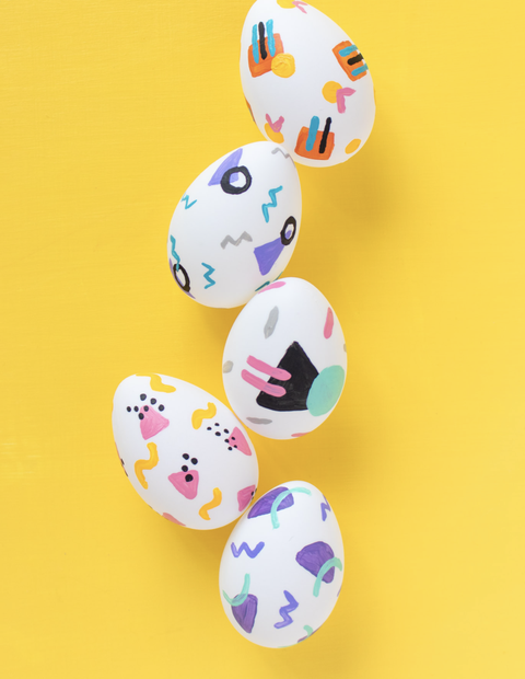 easter egg hunt ideas, five white eggs painted in a '90s pattern