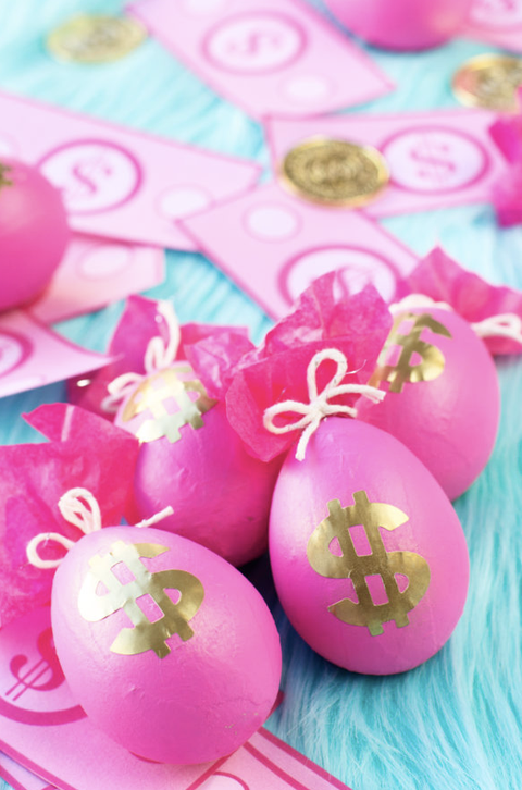 easter egg hunt ideas, pink eggs with gold dollar sign stickers on the front