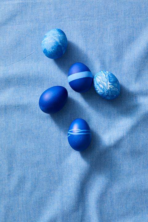 easter egg hunt ideas, five eggs dyed in indigo on a blue cloth