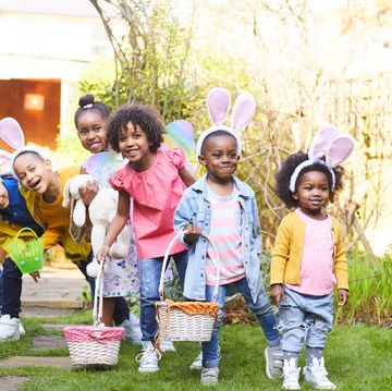 children with bunny ears and baskets ready for an easter egg hunt