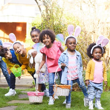 children with bunny ears and baskets ready for an easter egg hunt