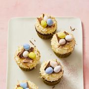 chocolate easter egg cupcakes with chocolate eggs on top in a nest
