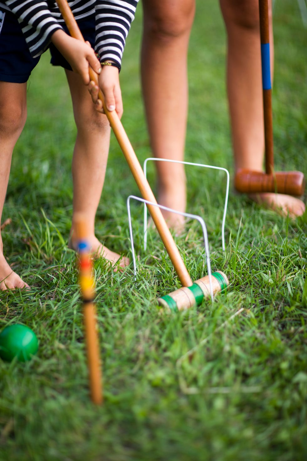 children playing croquet