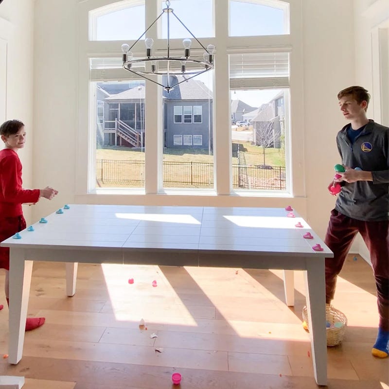 two kids playing easter game with peeps