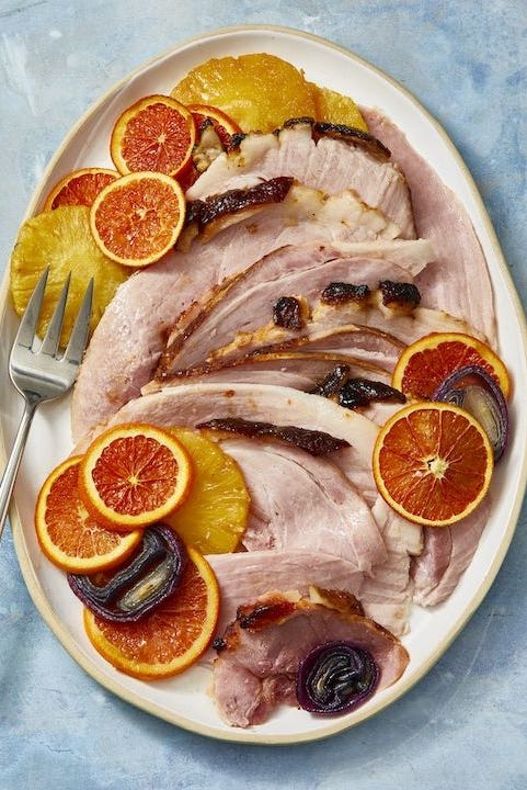 pineapple glazed ham with slices of citrus served on top