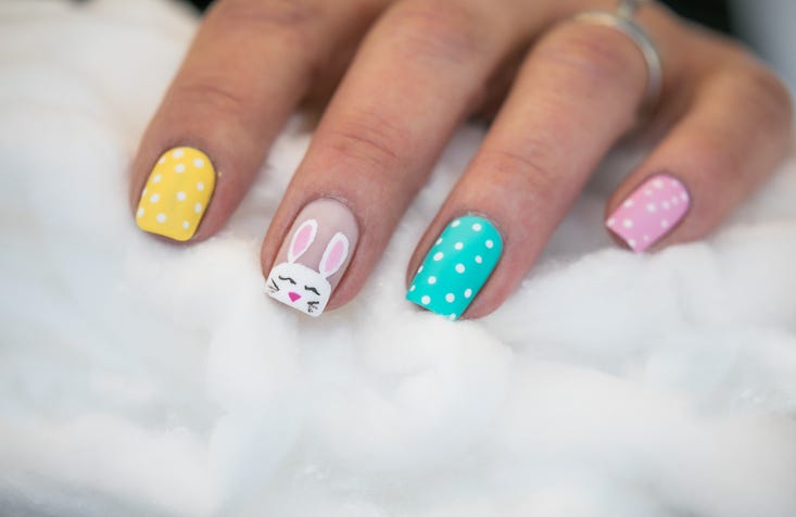 springtime easter nail art design with a bunny face on an accent nail