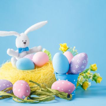 pastel colored easter egg decorations over blue background