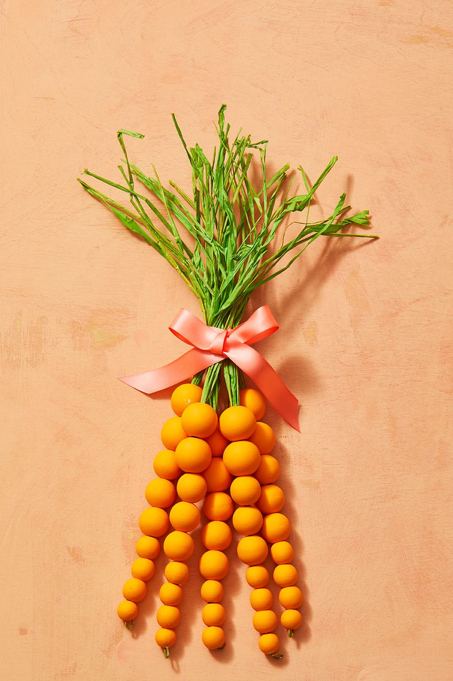 easter crafts, beaded carrot wreath with a pink bow