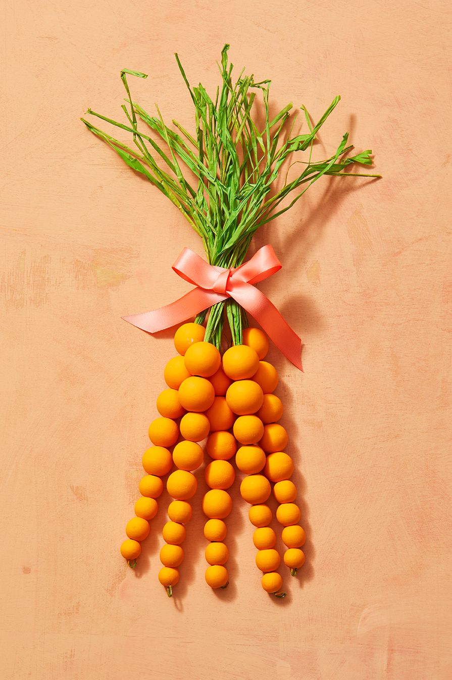 easter crafts, beaded carrot wreath with a pink bow