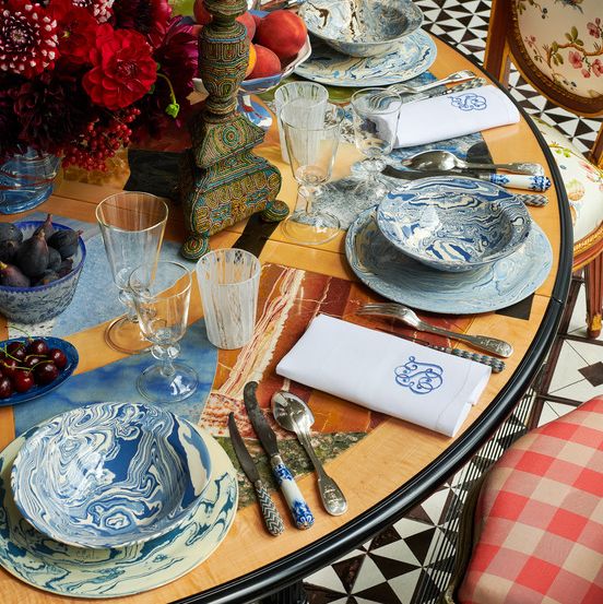 blue and white dishes set on an eclectic table