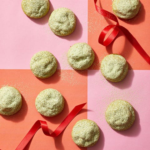 snowball cookies with matcha powder sprinkled on top