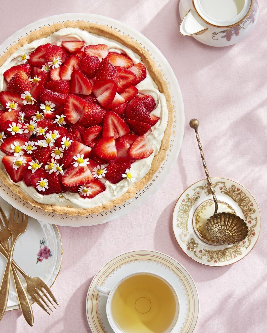 chamomile mascarpone tart with fresh strawberries and chamomile flowers on top