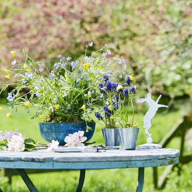 easter table display with flowers and bunny rabbit
