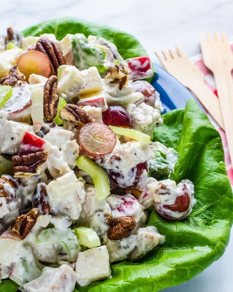 chicken waldorf salad on lettuce with wooden forks