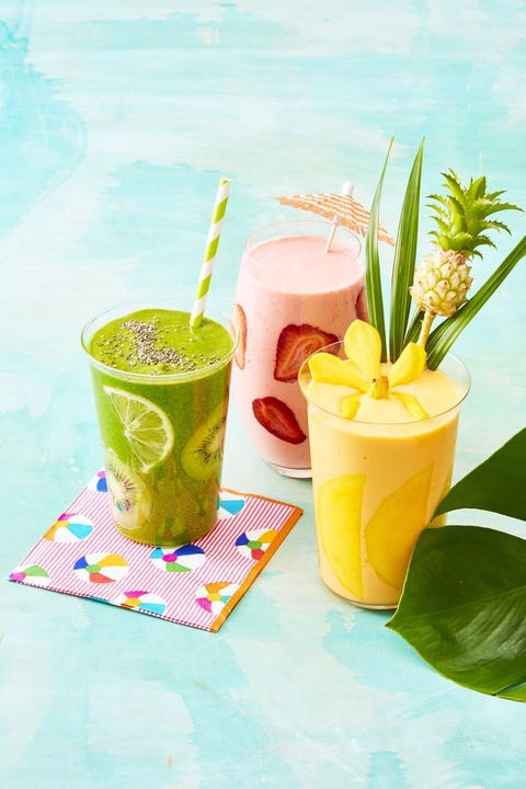 weight loss smoothies kiwi strawberry and pineapple smoothies on a blue surface