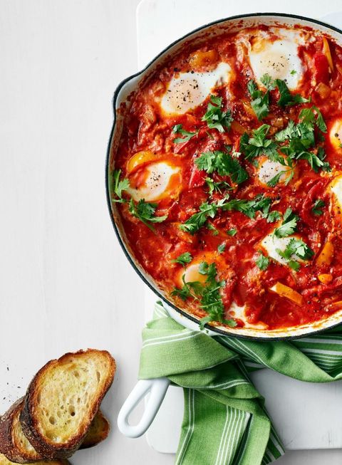 breakfast ideas for kids stewed peppers and tomatoes with eggs in skillet with bread
