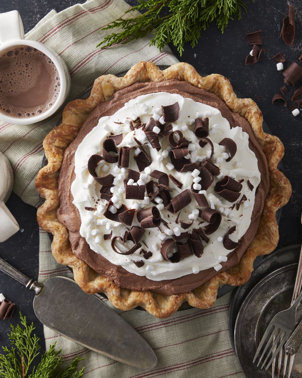 hot chocolate ice box pie with whipped cream chocolate curls and mini marshmallows on top