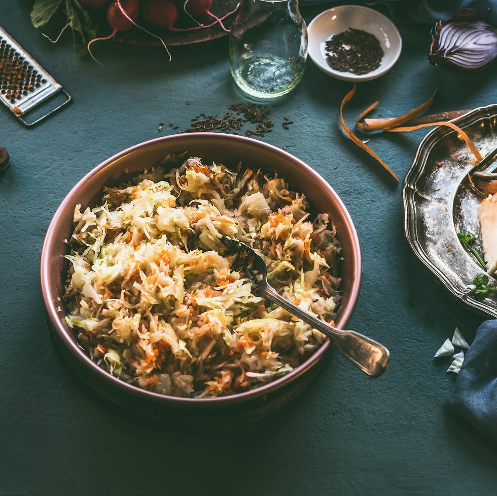 thanksgiving traditions   easy cole slaw cabbage salad on kitchen table with ingredients