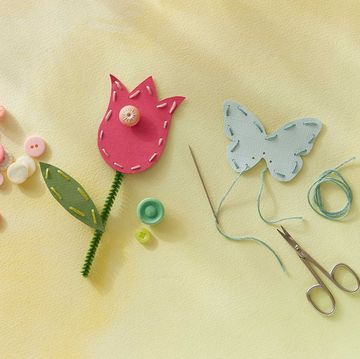 punch paper flowers and butterflies that are stitched with thread