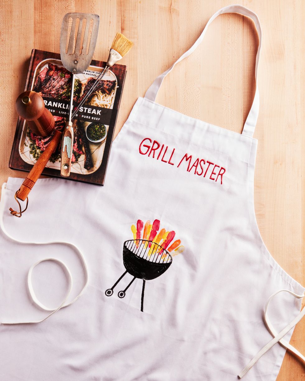 diy aprol with a grill and grill master painted on the front