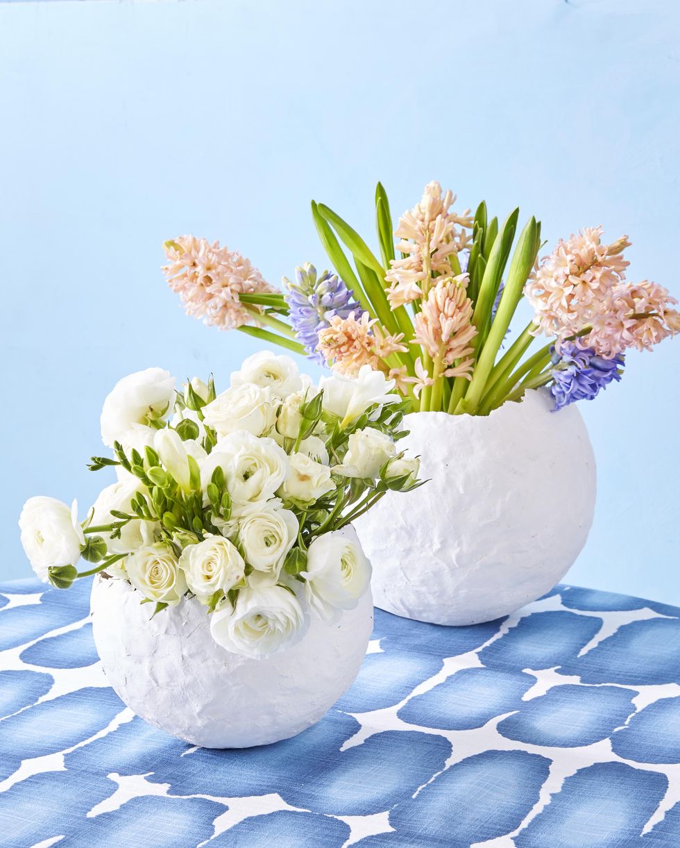 paper mache vases filled with blooms