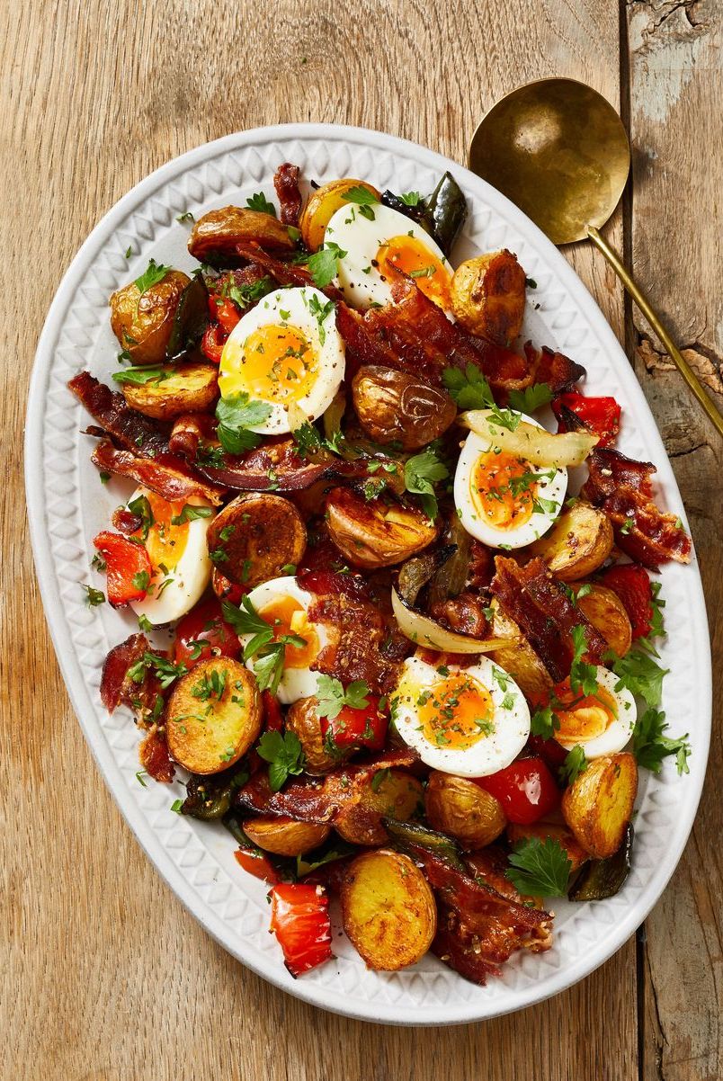 roasted hash and jammy eggs on a white plate