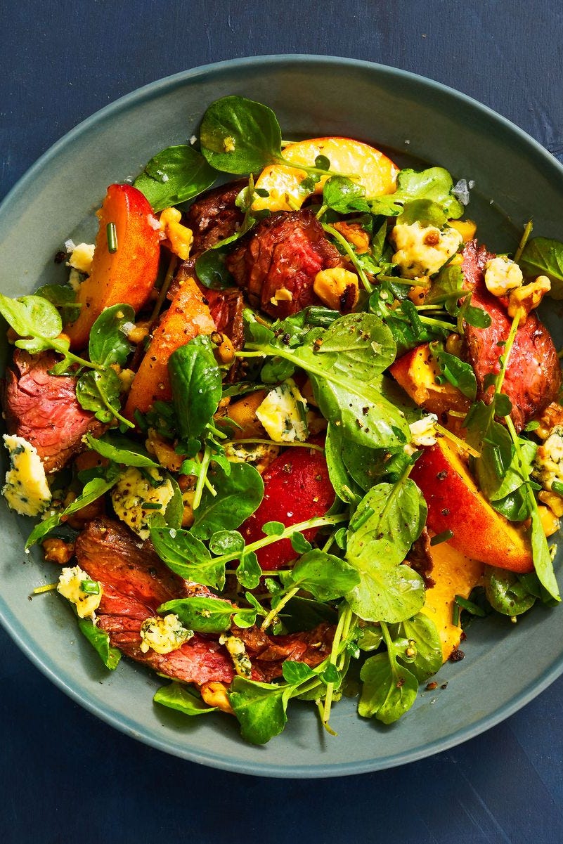 easy dinner ideas steak peach watercress salad on a plate