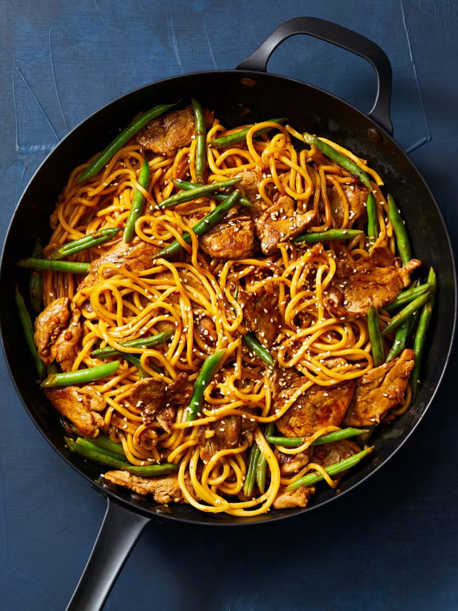 pork and green bean lo mein in a skillet