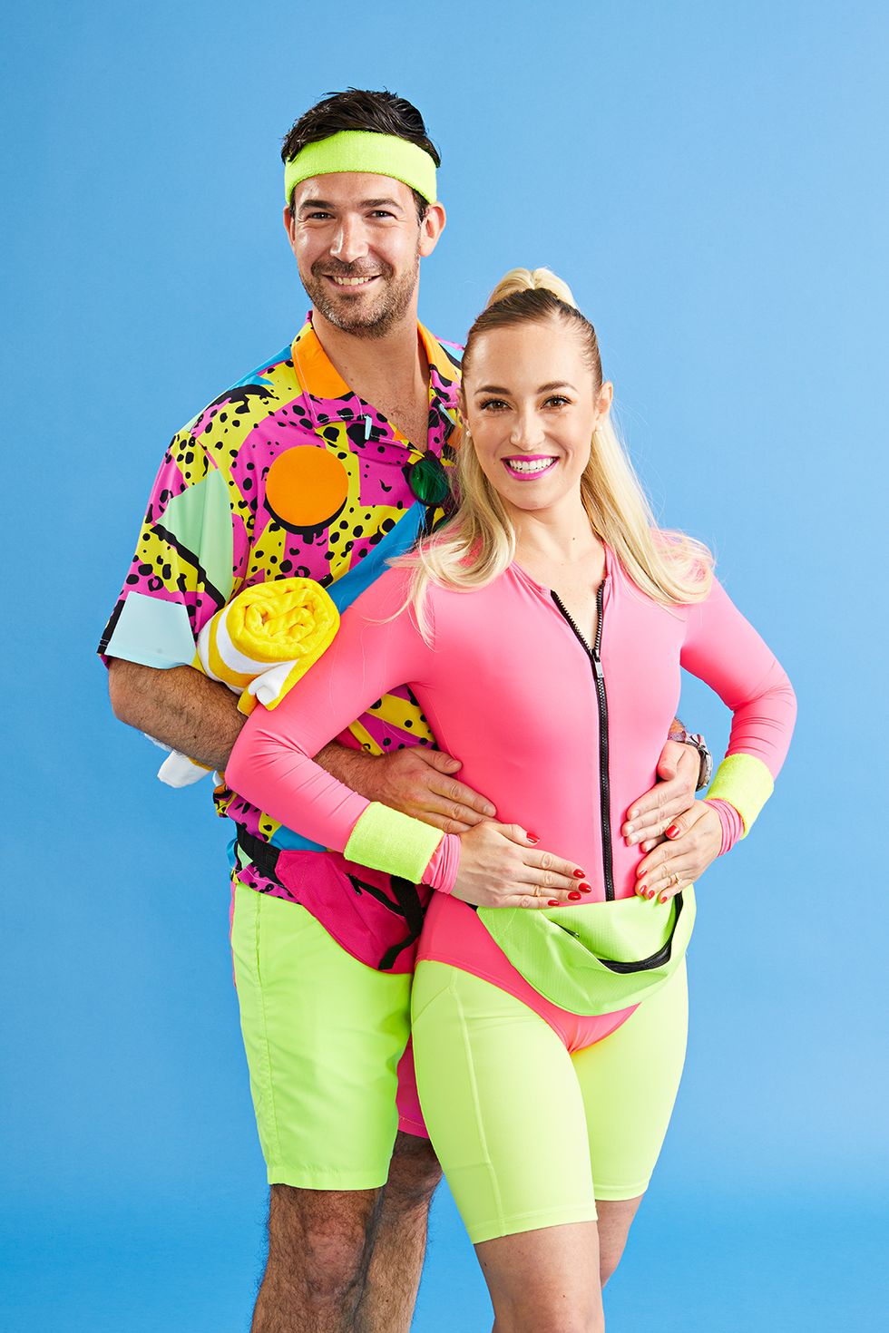 easy halloween costume, man and woman next to each other wearing colorful pink and green workout attire