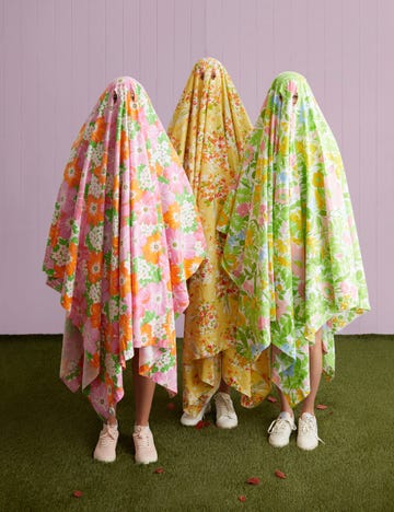 easy ghost halloween costume with colorful patterned sheets