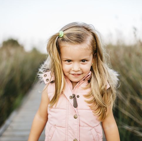 portrait of smiling little girl in nature