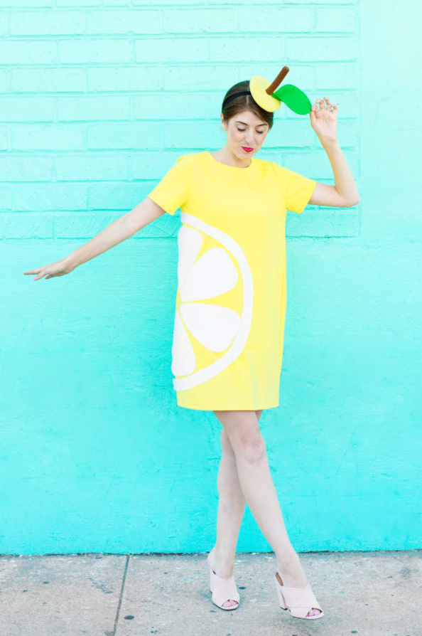easy halloween costume, woman wearing a diy yellow citrus slice costume