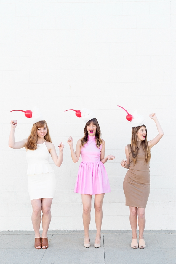 easy halloween costume, three women wearing diy milkshake costumes with diy cherries on their heads