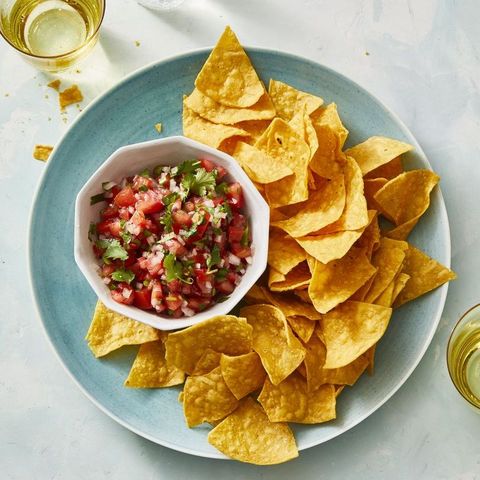 red salsa with chips on the side for dipping