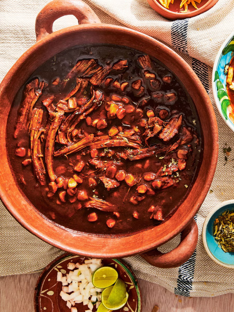 pozole rojo soup in a clay pot