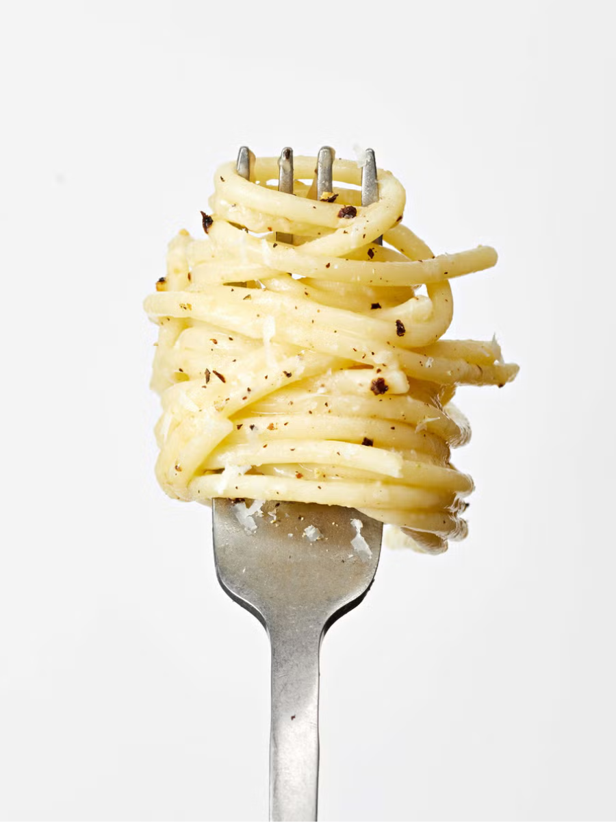 cheesy lemon pepper spaghetti twirled on a fork