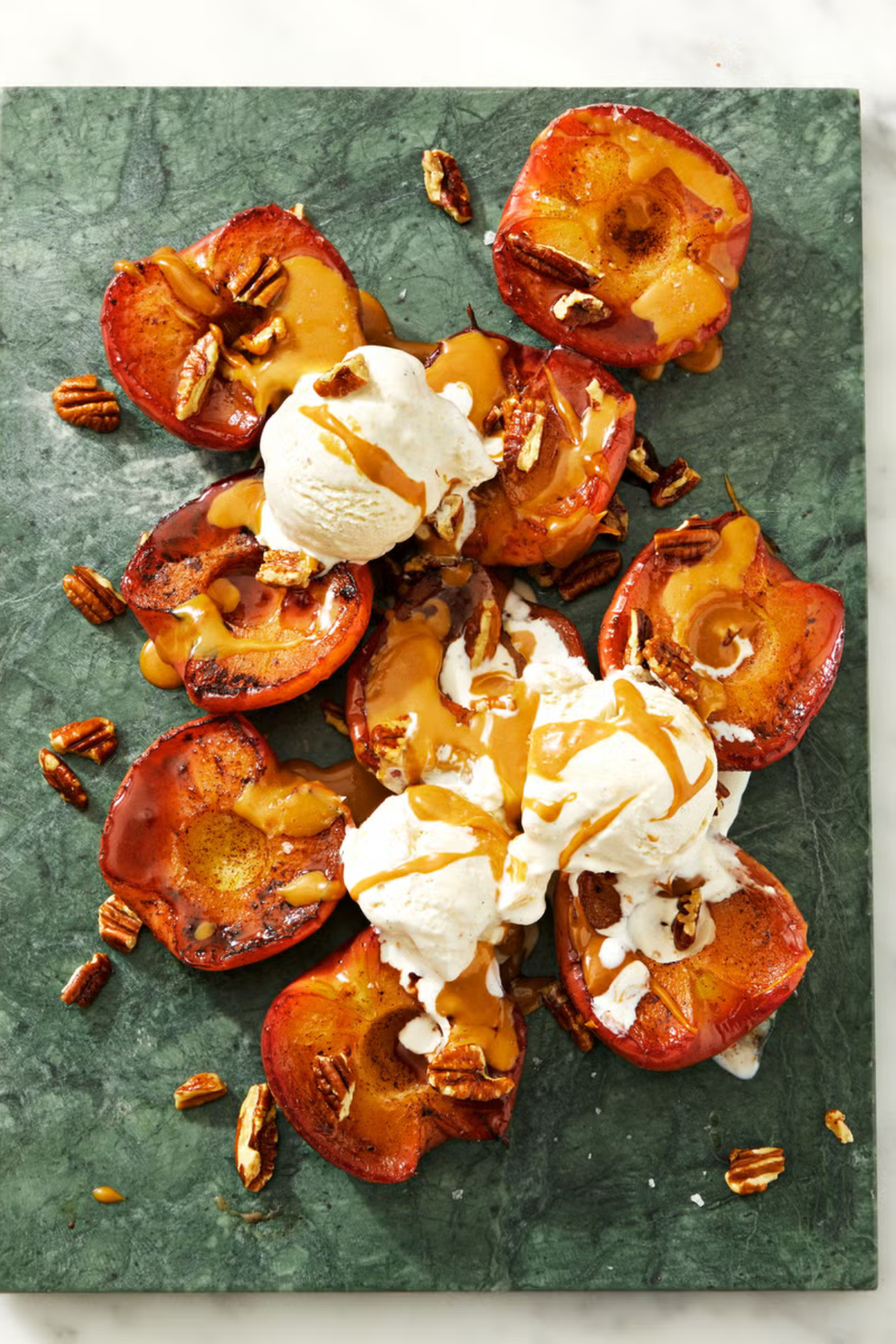 pie spice roasted apples with vanilla ice cream and dulce de leche on top