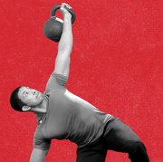 man doing a heavy kettlebell windmill and holding the position