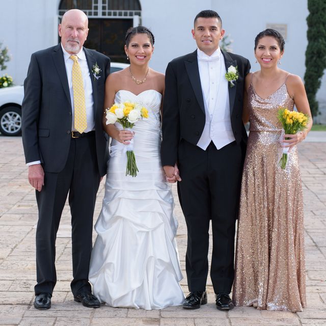 writer standing with her family at wedding